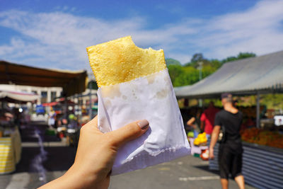 Pastel de feira. brazilian stuffed fried pastry against market fair in sao paulo, brazil.