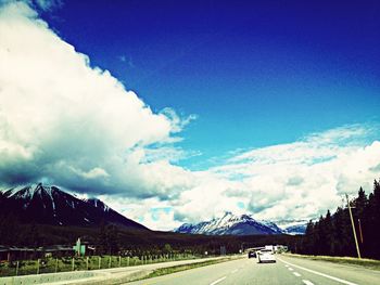 Country road with mountains in background