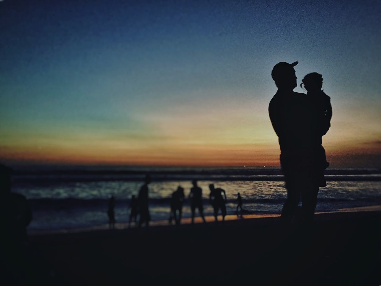 silhouette, sunset, togetherness, sea, leisure activity, men, lifestyles, water, beach, horizon over water, standing, sky, person, bonding, vacations, love, friendship, shore