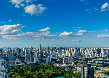 Aerial view of modern buildings in city against sky