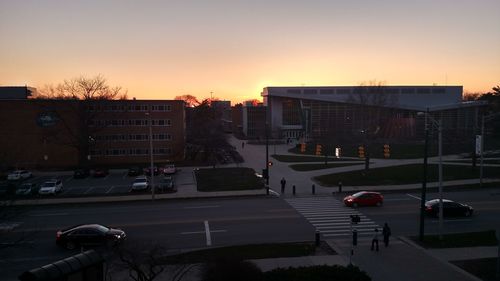 Buildings in city at sunset