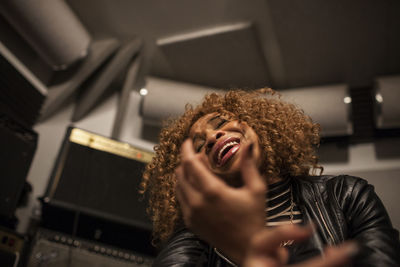 Singer performing in a recording studio