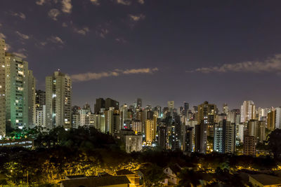 Illuminated buildings in sao paulo city, brazil,  against sky at night