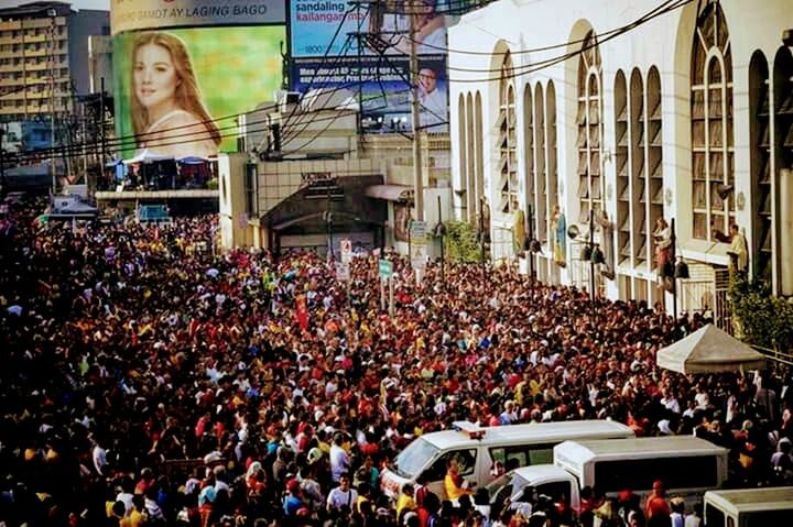 CROWD IN FRONT OF BUILDINGS