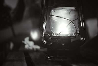 Close-up of illuminated lantern on table