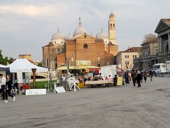 People on the road with church in background