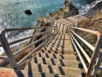 High angle view of steps leading towards sea