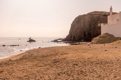 Scenic view of beach against clear sky