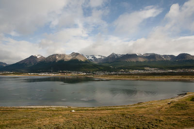 Scenic view of lake and mountains against sky