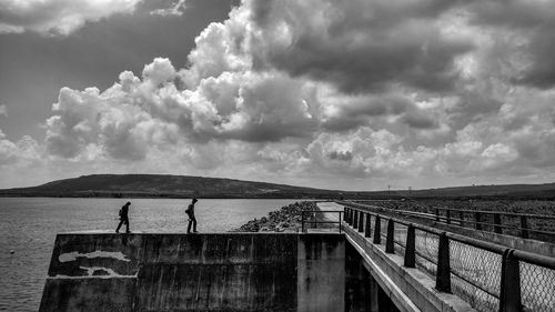 Scenic view of sea against cloudy sky