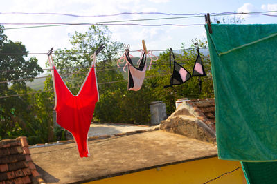 Wet swimsuits on the clothesline at roof