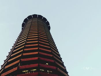 Low angle view of skyscraper against clear sky