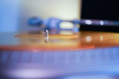 Close-up of water drop on table