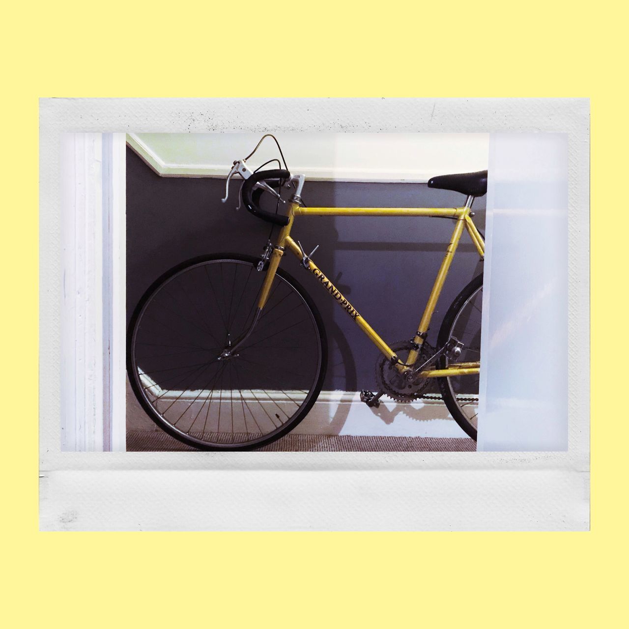 CLOSE-UP OF BICYCLE AGAINST WALL