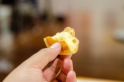 Close-up of hand holding ice cream