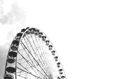 Low angle view of ferris wheel against sky