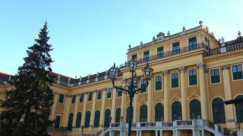 Low angle view of built structure against clear blue sky