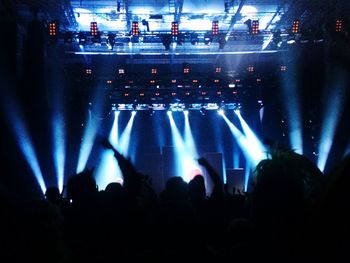 Rear view of people enjoying music concert