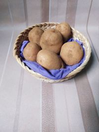 High angle view of fruits in basket on table