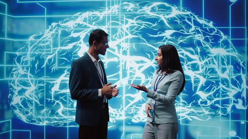 Portrait of business colleagues standing in swimming pool