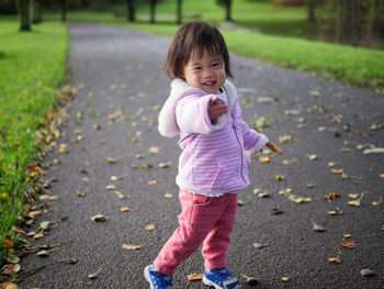 Portrait of cute girl standing outdoors