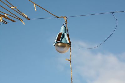 Low angle view of cables against clear blue sky