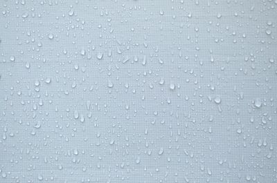 Full frame shot of raindrops on glass