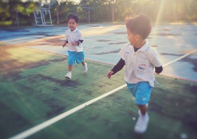 Siblings playing outdoors