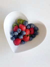 High angle view of strawberries in bowl on table