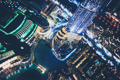 High angle view of illuminated buildings in city at night