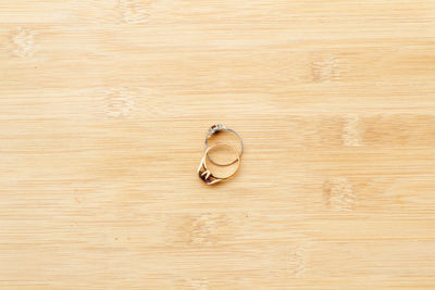 High angle view of ring on wooden table