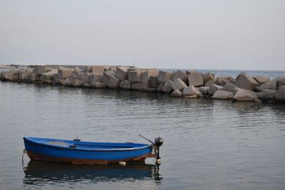 Boats moored in sea