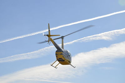 Low angle view of airplane against sky