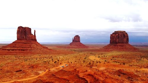 Rock formations on landscape against sky