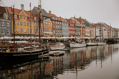 Boats moored at harbor