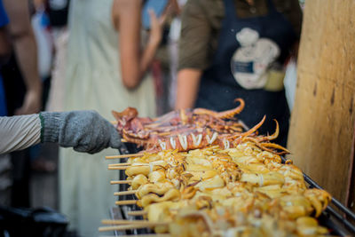 Midsection of man preparing food