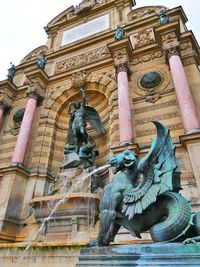 Low angle view of statue of historic building