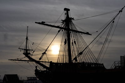 Low angle view of electricity pylon against sky