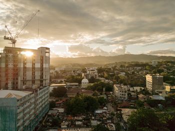 High angle view of buildings in city against sky