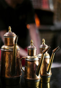 Close-up of wine glasses on table