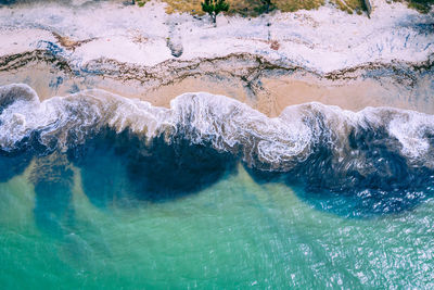 High angle view of sea by rocks