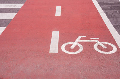 High angle view of arrow sign on road