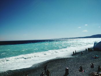 Scenic view of sea against blue sky