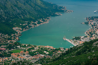 High angle view of townscape by sea