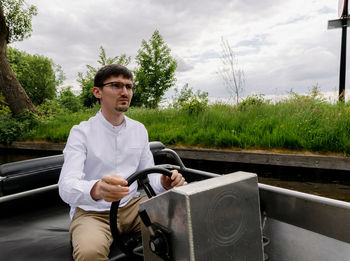 Portrait of man sitting in car