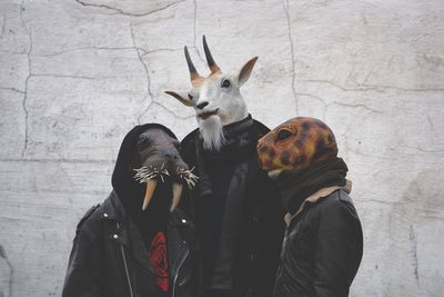 People wearing animal masks