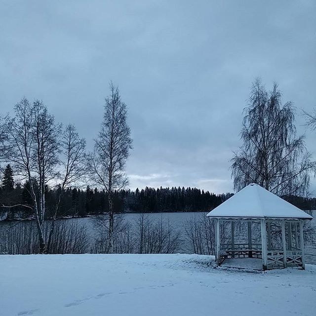 snow, winter, cold temperature, bare tree, sky, weather, tree, season, built structure, tranquil scene, tranquility, landscape, nature, architecture, field, covering, cloud - sky, scenics, beauty in nature, building exterior