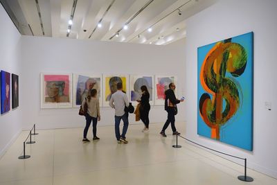 People standing in front of museum