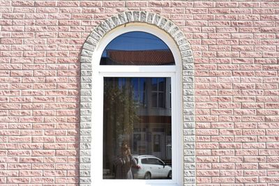 View of window on brick wall of building