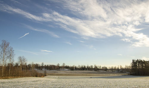 Scenic view of land against sky during winter